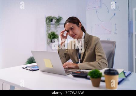 Office Environment - Frustrated overworked office worker at her