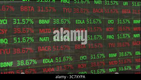 Showing stock ticker panel displaying percentage changes in trading office, grid lines Stock Photo
