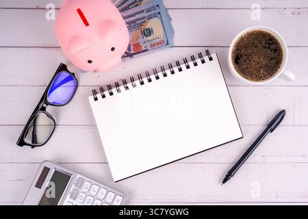 Top view of blank notepad financial concept flat lay Stock Photo
