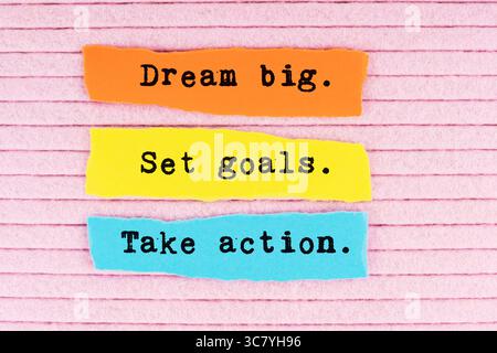 Torn paper with quotes dream big. Set goals. Take action on pink background Stock Photo