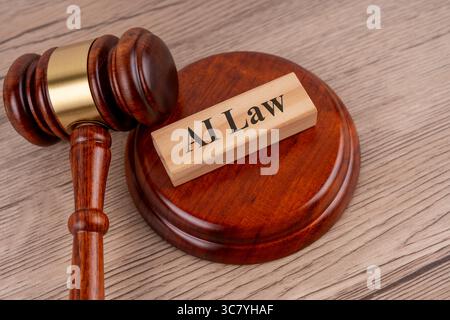 Top view of gavel and AI law text on wooden block Stock Photo