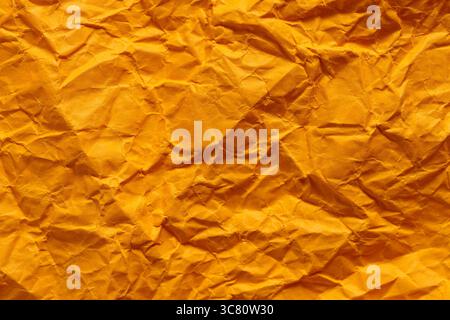 Crumpled Golden Yellow Paper Texture Background Abstract Pattern Stock Photo