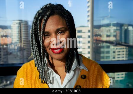 Portrait of an African woman looking at camera smiling. Stock Photo