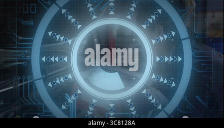 Displaying circular overlay radiating arrows and circuits in office with suited man holding tablet Stock Photo