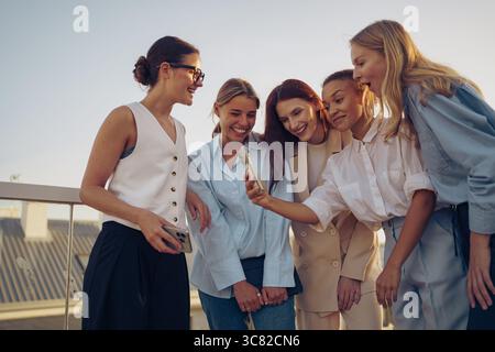 A group of friends is having a joyful moment together while enjoying the great outdoors Stock Photo