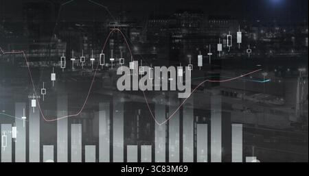 Displaying data overlay over night downtown skyline with candlesticks, trend and numbers Stock Photo