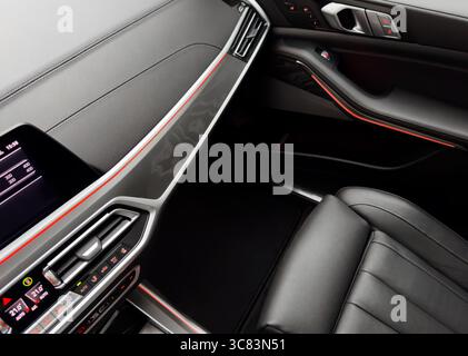 Modern car Interior. Dashboard. Detail of modern car interior. Automatic gear stick. Part of leather seats with stitching Stock Photo