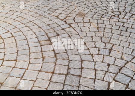 Sidewalk tiles. Closeup of paving slabs background. Street paving slabs. Cement block of the road. Cement brick squared stone floor background. Stock Photo