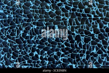Broken tempered glass closeup texture background. Glass pattern. Cracked broken destroyed glass damaged window background Stock Photo