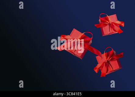 Red gift boxes with ribbon on blue background boxing day Stock Photo