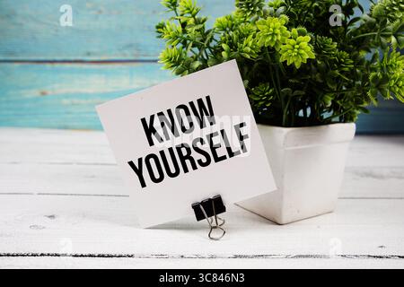 Know Yourself text written on paper card on wooden background Stock Photo