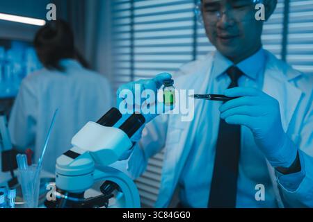 lab, scientist working on scientific equipment in modern laboratory, International team of scientists working together in medical laboratory doing res Stock Photo