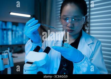 lab, scientist working on scientific equipment in modern laboratory, International team of scientists working together in medical laboratory doing res Stock Photo
