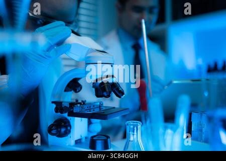 lab, scientist working on scientific equipment in modern laboratory, International team of scientists working together in medical laboratory doing res Stock Photo