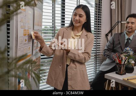 ux developer and ui designer brainstorming about mobile app interface wireframe design in the office, website designer, creative planning phone app de Stock Photo