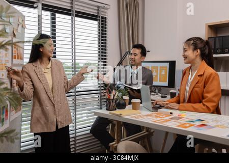 ux developer and ui designer brainstorming about mobile app interface wireframe design in the office, website designer, creative planning phone app de Stock Photo