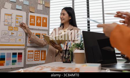 ux developer and ui designer brainstorming about mobile app interface wireframe design in the office, website designer, creative planning phone app de Stock Photo