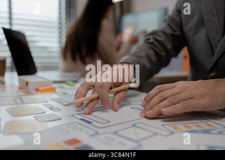 drawing website ux ui app for mobile phone application and development template layout, UI development, designer team working on a project of ux ui in Stock Photo