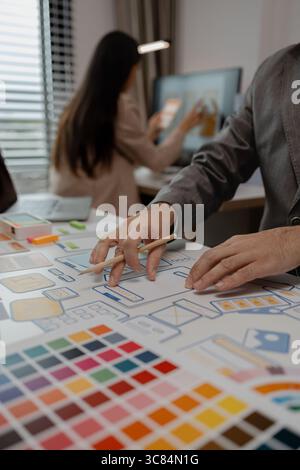 drawing website ux ui app for mobile phone application and development template layout, UI development, designer team working on a project of ux ui in Stock Photo
