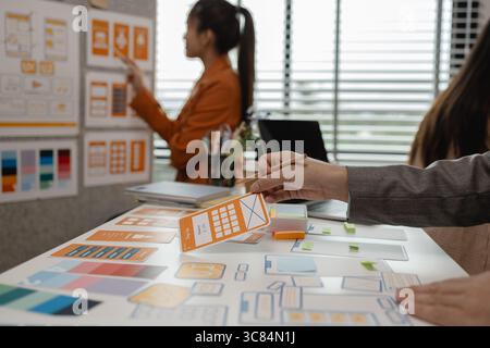 drawing website ux ui app for mobile phone application and development template layout, UI development, designer team working on a project of ux ui in Stock Photo