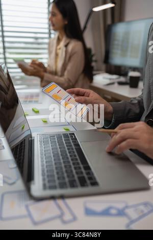 drawing website ux ui app for mobile phone application and development template layout, UI development, designer team working on a project of ux ui in Stock Photo