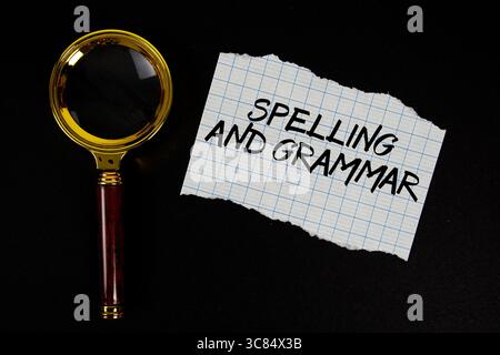 Spelling And Grammar text written on paper with magnifying glass Stock Photo