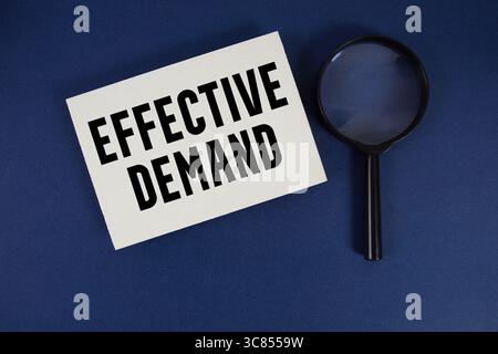 Effective Demand text written on paper with magnifying glass Stock Photo