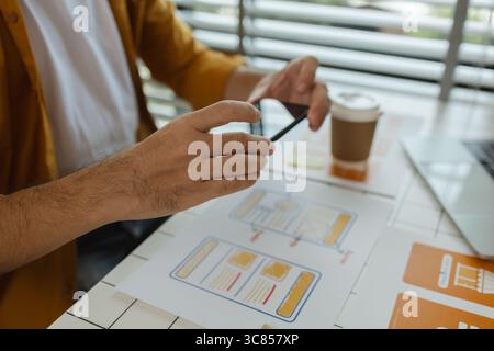 A web developer, as a User Experience and User Interface Officer is analyzing data from his ideas to develop the structure and components of a digital Stock Photo