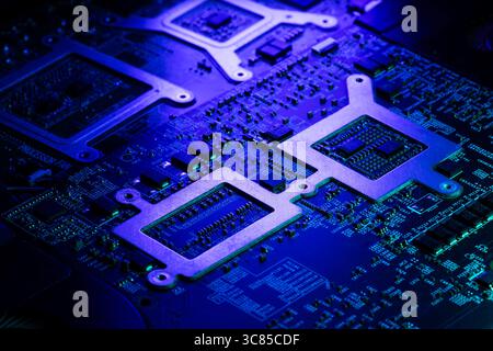 Macro View of Laptop Internal Components and PCB with Green and Blue Futuristic Accent Lighting Stock Photo