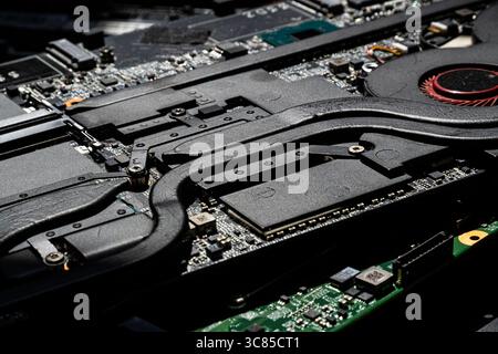 Close-Up of Laptop Cooling System Heatpipes and Component Layout on the Motherboard for Thermal Management Stock Photo