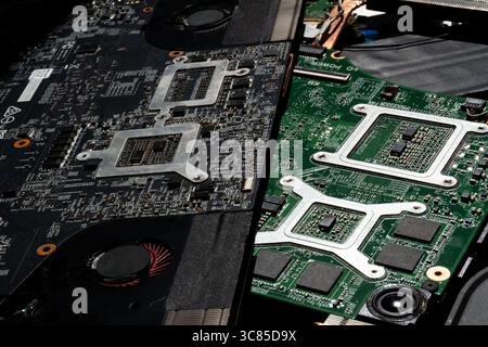 High-Resolution Close-Up of Laptop Cooling Fans, Circuit Board, and Components in Bright Technical Lighting Stock Photo