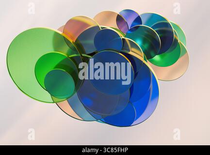 3D rendering of Overlapping Transparent Green and Blue Glass Discs Creating Soft Abstract Patterns on a Light Background Stock Photo