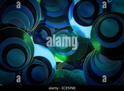 3D rendering of Overlapping Transparent Blue and Green Glass Discs Creating Abstract Patterns with Light and Reflection Effects Stock Photo