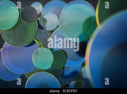 3D rendering of Overlapping Transparent Blue and Green Glass Discs Creating Abstract Patterns with Light and Reflection Effects Stock Photo