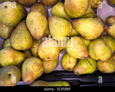 Juicy pears neatly arranged in the mall. Stock Photo