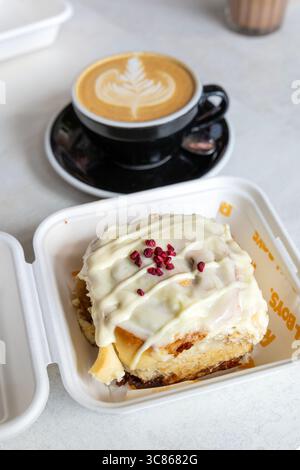 Raspberry white chocolate cinnamon roll  and coffee, Roll Boys residency at Saint Espresso Hackney, London, England Stock Photo