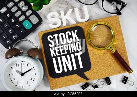 SKU - Stock Keeping Unit acronym with calculator, alarm clock and magnifying glass, business concept background Stock Photo