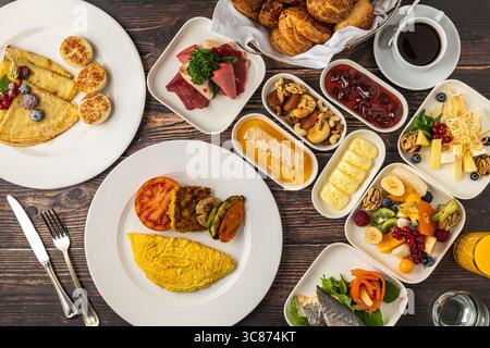 Top view of rich Turkish and continental breakfast served on wooden table Stock Photo