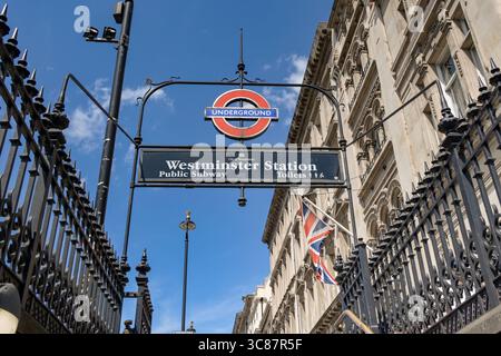London, England, UK - 4 July 2025: Low angle view of the sign above the entrance to the public subway and Underground station at Westminster Stock Photo