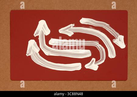 white color panted arrows on red Stock Photo