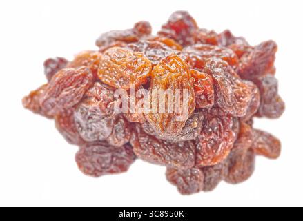 Organic raisins isolated on white background, selective focus. Stock Photo