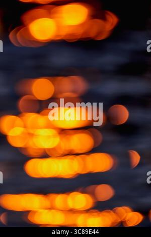Gilded Ripples Dance Upon Molten Waters Stock Photo