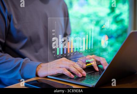 Businessman or Analyst using KPI dashboard on screen with business analytics and data management system of the company. Corporate strategy for finance Stock Photo