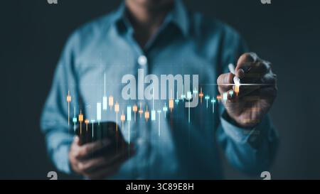 Stock trading and investing concept. Businessman writing graph chart for analysis stock market price. Virtual stock market graph. foreign exchange, tr Stock Photo