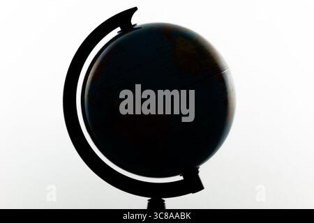 Close up to an earth globe silhouette with withe background. Geography and astronomy concept Stock Photo