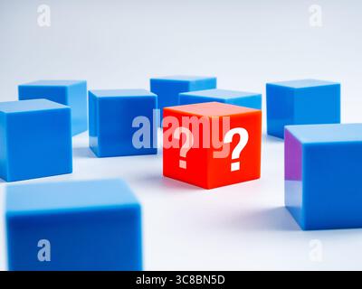 Question box, quiz, problems solvings, doubt, suspicious, business solution concept. Red different one cube with question mark icon, standing near the Stock Photo