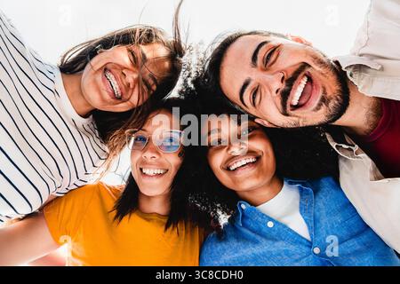 Happy diverse friends smiling and enjoying time together outdoors Stock Photo