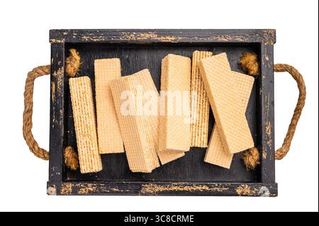 Wafer stick biscuits with vanilla cream in wooden tray isolated on white background. top view. Stock Photo