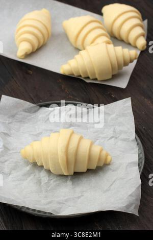 Proofed Croissants Over Nonstick Baking Sheet, Ready To Bake Stock Photo