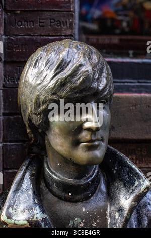 Liverpool, UK - September 19th 2024: Statue of music icon and former Beatle - John Lennon, located on Mathew Street opposite the historic music venue Stock Photo